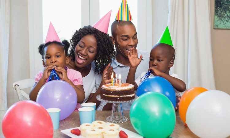bigstock-Happy-family-celebrating-a-bir-69733369