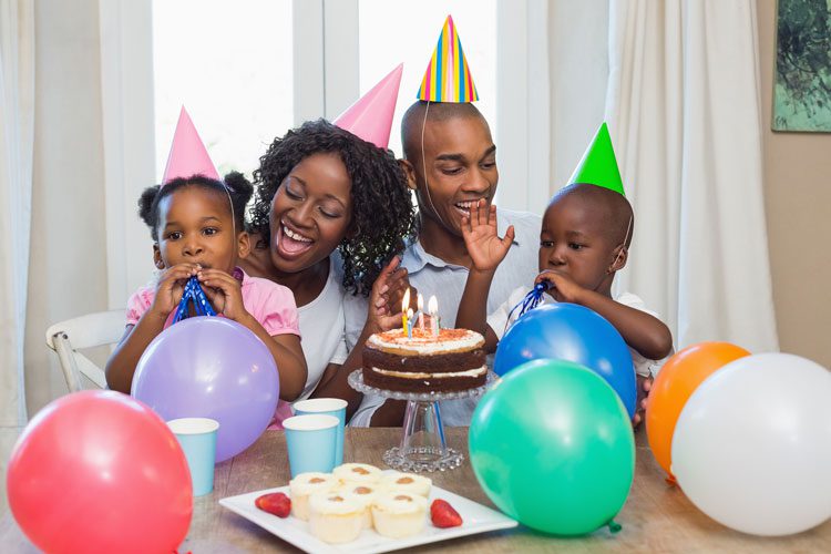 bigstock-Happy-family-celebrating-a-bir-69733369